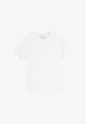 Biała bawełniana koszulka z dekoltem w serek i krótkim rękawem. Miękka tekstura, proste wykończenie i subtelny detal logo na piersi. Prosty i klasyczny design.