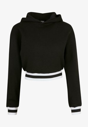 Fekete, cropped kapucnis pulóver hosszú ujjakkal, húzózsinóros kapucnival, és kontrasztos fehér csíkokkal az alján és az ujjak mandzsettáján. Puha anyagból készült.