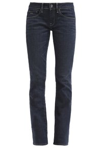 Ciemne dżinsy slim fit, z klasycznym wzorem pięciu kieszeni, subtelnymi przeszyciami oraz zamkiem błyskawicznym i zapięciem na guzik.