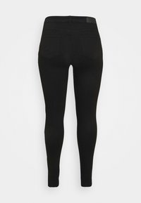 Black skinny jeans featuring a smooth texture, high waistband, and two back pockets. The fabric appears stretchy and form-fitting.