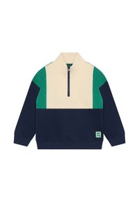 Farbblockierter Pullover in Creme, Navy und Grün mit hohem Kragen, halbem Reißverschluss vorne und einer strukturierten Stoffoberfläche. Mit einem Logo-Patch.