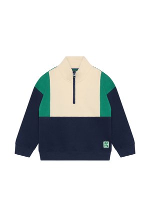 Farbblockierter Pullover in Creme, Navy und Grün mit hohem Kragen, halbem Reißverschluss vorne und einer strukturierten Stoffoberfläche. Mit einem Logo-Patch.