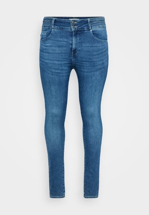 Jeans skinny in denim blu medio, con una vita alta, due tasche frontali e leggeri sbiadimenti per un effetto di texture.