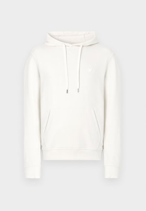 Bijela majica s kapuljačom i vrpcom za vezanje, prednjim džepom na preklop i malim trokutastim logotipom. Mekani materijal s glatkom teksturom.