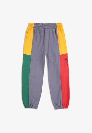Gray sweatpants with yellow, green, and red color blocks on legs, elastic waistband and cuffs, and blue stitched text on red panel.