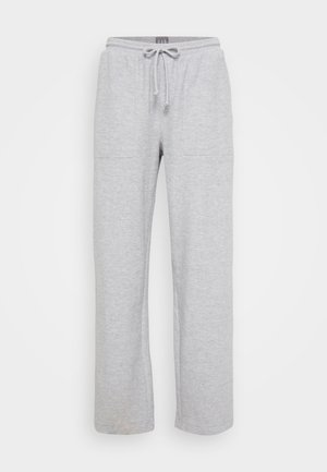 Ljust grå avslappnade sweatpants i mjukt material med två sidofickor och ett elastiskt midjeband med snörning.