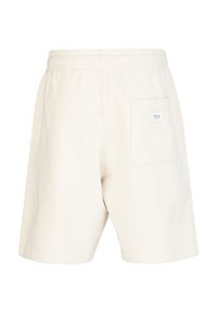 Lichtbeige katoenen shorts met een elastische tailleband en een achterzak met een klein logolabel. Gladde textuur en relaxte pasvorm.