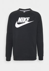 Sudadera negra de Nike con un gran logo blanco de la marca en la parte frontal, con cuello redondo y puños acanalados. Textura de tela suave.