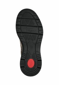 Semelle en caoutchouc noire d'une chaussure avec des motifs de la bande de roulement, marquage taille 37, et une insertion circulaire rouge étiquetée "Tamaris Comfort."