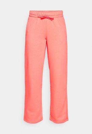 Korallfärgade sweatpants tillverkade av mjukt tyg. Har ett elastiskt midjeband med dragsko och rak byxdessign. Inga fickor.