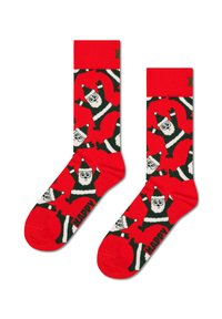 Červené ponožky s opakujícím se vzorem kreslených postaviček Santy v zelené a bílé, zdobené textem "ŠŤASTNÝ". Měkký pletený materiál.