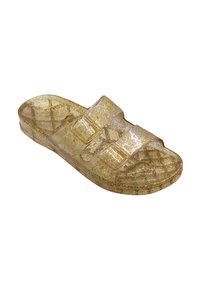 Sandale transparente en paillettes dorées avec deux larges brides, semelle structurée et semelle plate ; présente une surface lisse et réfléchissante.