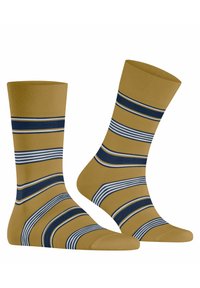 Gestreifte Socken mit einem senfgelben Grundton und marineblauen sowie weißen Streifen. Strickstoff mit einer glatten Textur und elastischem Bündchen.
