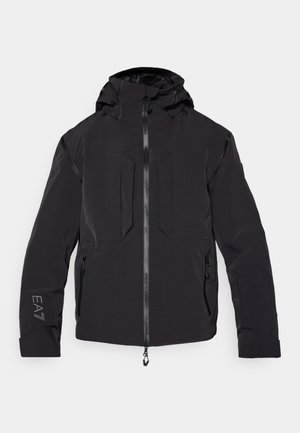 Black waterproof jacket featuring a zip front, adjustable hood, two front pockets, and a textured finish with minimalistic design details.