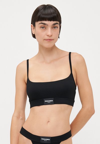 Black bralette in soft fabric with thin straps, rectangular shape, elastic band featuring the DSQUARED2 logo at the bottom.