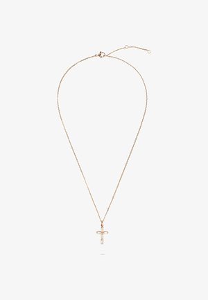 Fin gyldenkæde med en lille korsvedhæng med klare ædelsten, vist på en hvid baggrund.