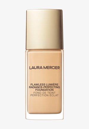 Beige lasipullo pohjustajalle, jossa on kultainen korkki. Mustalla tekstillä lukee "Flawless Lumière Radiance-Perfecting Foundation." Sileä koostumus.