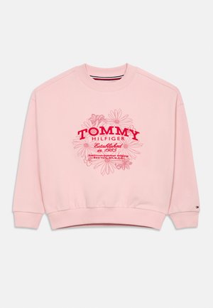 Sudadera de color rosa claro con texto rojo "Tommy Hilfiger", arte lineal floral y la inscripción "Establecido en 1985" en el frente, con puños y cuello acanalados.