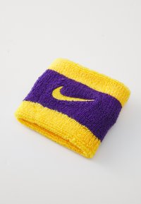 Nike wristband featuring yellow and purple terrycloth material, with a prominent yellow swoosh logo on a purple background.
