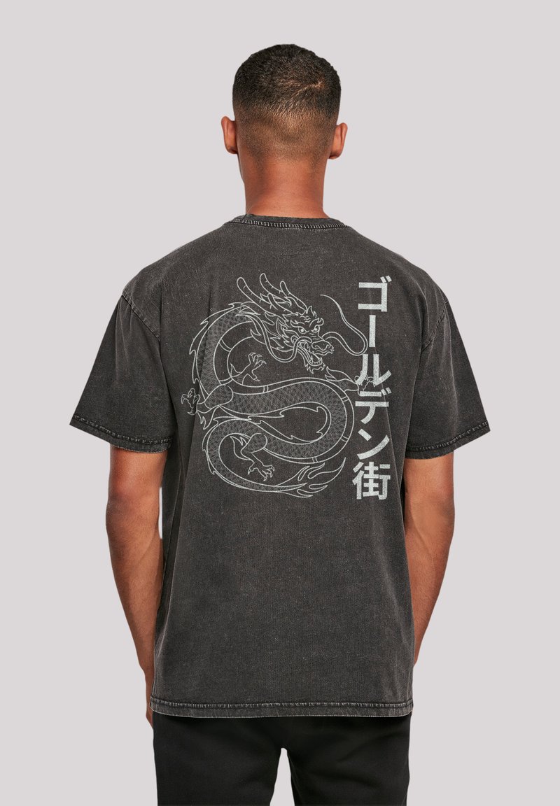 Black cotton t-shirt with a dragon graphic and Japanese text on the back. Short sleeves, crew neck, and faded finish.