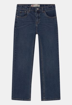 Klassiset suorat tummansiniset farkut, joissa on viisi taskua, vyölenkit ja nappisulku vyötäröllä.