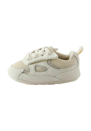 Beige toddler sneaker with mesh and suede panels, lace-up front with pull tab at heel, designed for comfort and breathability.