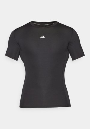 Schwarzes, kurzärmeliges Kompressions-Sportshirt mit Rundhalsausschnitt und kleinem weißen Adidas-Logo auf der Brust, entworfen für sportliche Leistung.
