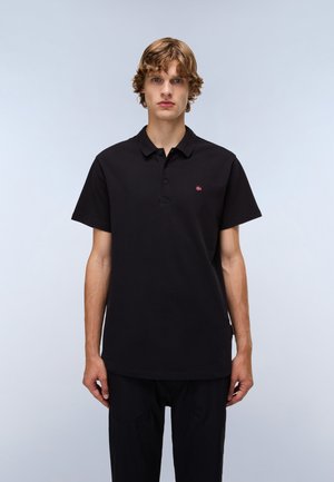Black polo shirt made of cotton with a three-button placket and short sleeves. Features a small red and white logo on the left chest.