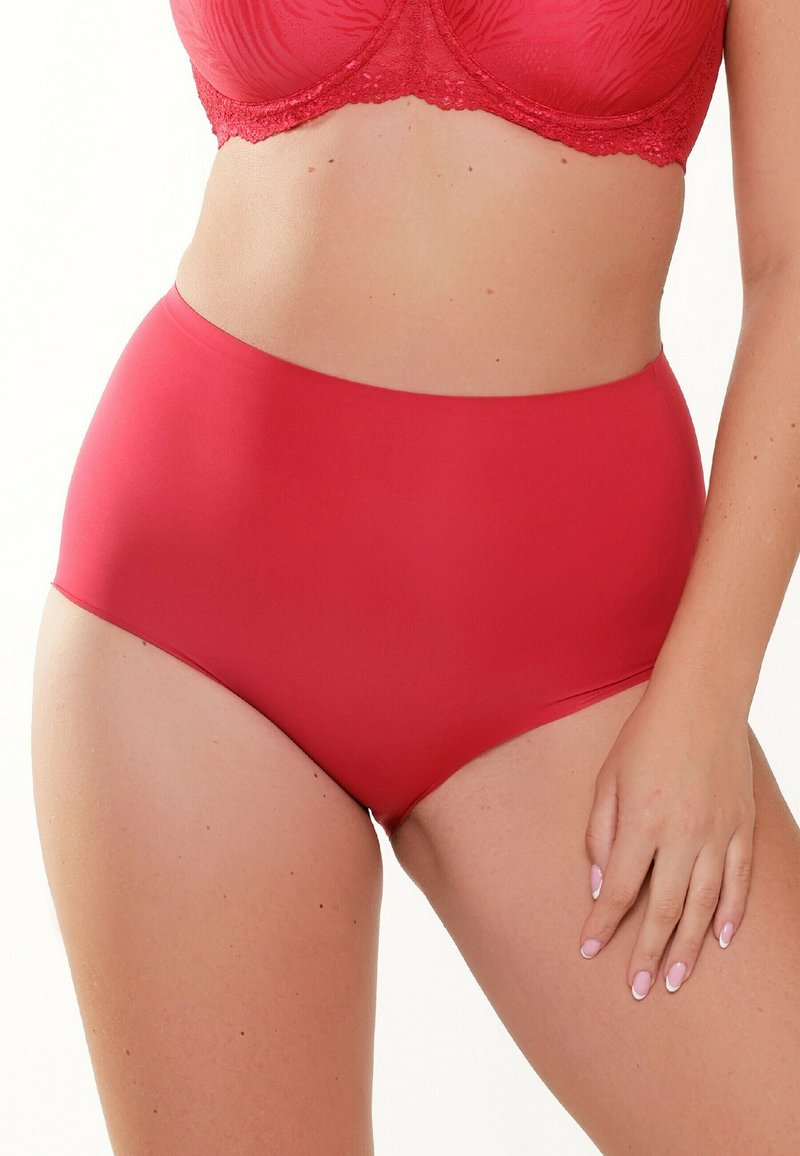 Högmidjade röda underkläder i mjukt, elastiskt tyg med sömlös design. Har minimal sömnad för komfort och en stilren look.