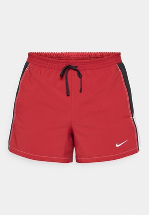 Red athletic shorts with an elastic waistband and adjustable black drawstring. Side panels in black, featuring white stitching and Nike logo.