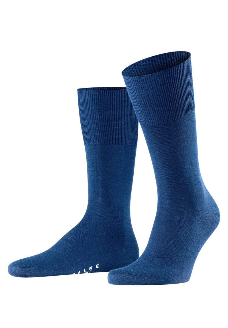 Tengerészkék zokni sima textúrával, bordázott mandzsettákkal és ergonomikus kialakítással. Finom márkajelzés a lábujjrészen. Légáteresztő anyagból készült.