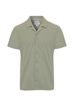 Chemise à manches courtes à boutons de couleur vert clair, fabriquée en matériau doux, avec un col pointu et six boutons à l'avant. Coupe régulière.