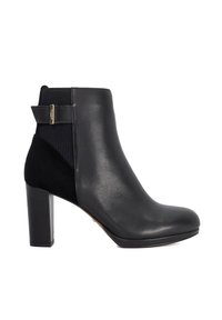 Black leather ankle boot with a block heel, featuring a textured fabric panel and a gold accent on the back for easy pull-on.