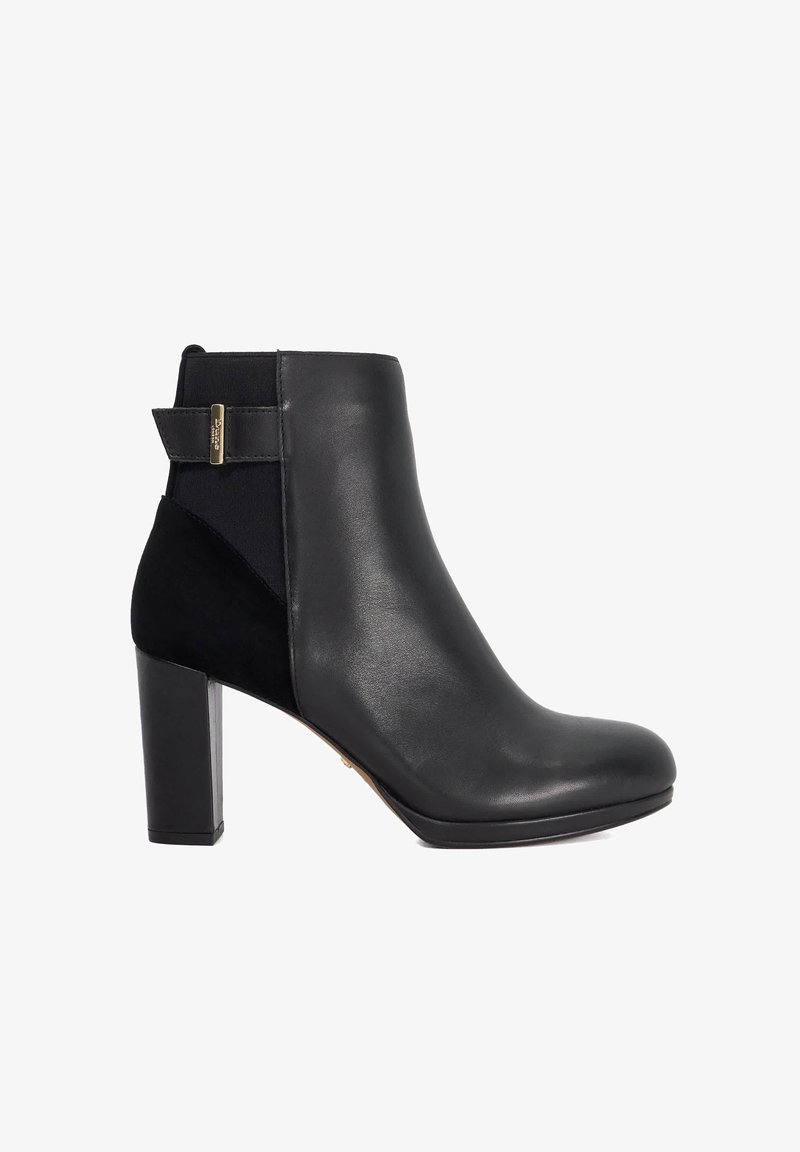 Black leather ankle boot with a block heel, featuring a textured fabric panel and a gold accent on the back for easy pull-on.