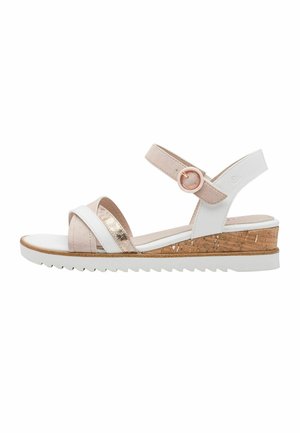 Sandale pour femme blanche et beige avec talon compensé en liège, bride avec boucle, et lanières croisées à l'avant sur fond blanc.