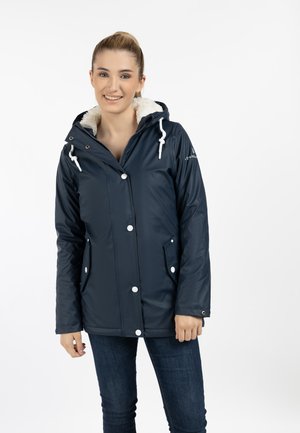 Navy waterproof jacket with a faux fur-lined hood, snap buttons, and front pockets; features white drawstrings and accents.