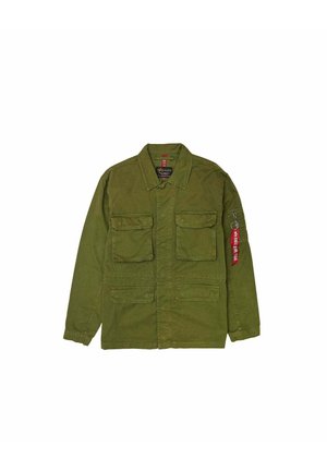 Olive green military-style jacket. Features four front pockets, a collared neck, and a red fabric tag on the left sleeve. Cotton material.