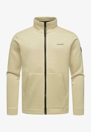 Beige zip-up jas met een hoge kraag en twee voorkanten zakken. Textuurstof en zwarte ritsdetails verhogen het ontwerp.