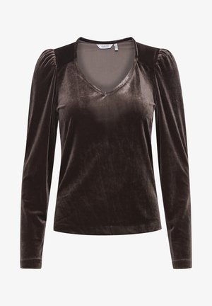 Rudas aksominis ilgomis rankovėmis topas su V formos iškirpte, susiraukšlėtomis petnešėlėmis ir lygiu paviršiumi. Reguliaraus silueto, su nežymiu blizgesiu.