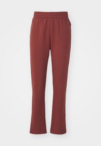 Pantalones de chándal granate hechos de tela suave, con cintura elástica, diseño de pierna acampanada y sin bolsillos ni adornos visibles.