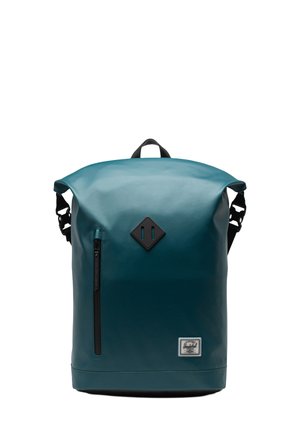 Teal waterproof backpack with roll-top closure, black accents, front zip pocket, and a textile logo patch. Adjustable shoulder straps.