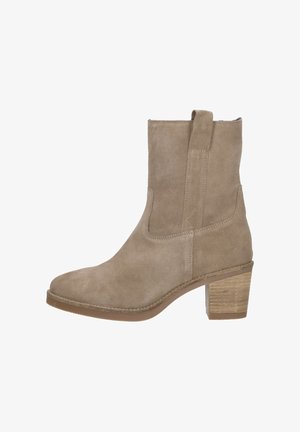 Beige suede ankle boot with pull tab, rounded toe, visible stitching, and stacked block heel in natural wood tone.