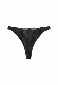 Schwarze Tanga-Unterwäsche mit einem transparenten Spitzenvorderteil und floralem Stickereimuster, glattem Stoff und minimalem Schnitt.