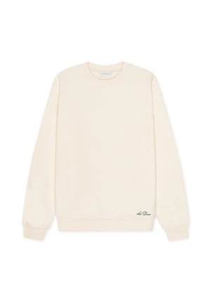 Sweatshirt couleur crème en matériau doux. Présente un col rond, des manches longues et un détail logo subtil à l'ourlet.
