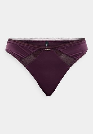 BOSS moteriškos apatinės kelnaitės tamsiai violetinės spalvos, pagamintos iš lygaus audinio ir tinklinės medžiagos. Dėvi logotipo detalę ir klasikinį žemą modelį.
