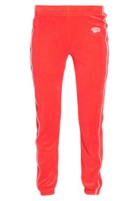 Röda Nike träningsoverallbyxor i mjukt tyg med vita sidostråk, elastisk midja och samlade mudd vid anklarna.