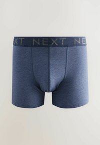 Mörkblå underkläder med mjuk textur, utrustade med en kontrasterande elastisk midjeband prytt med "NEXT" och en kroppsnära passform.