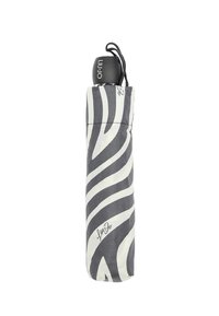 Ombrello compatto con motivo zebra bianco e nero, dotato di un manico nero e chiuso da un cordino. Presenta un dettaglio distintivo alla base.