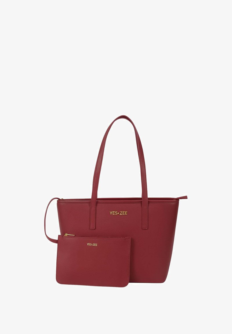 Borsa a tracolla in ecopelle rossa con due manici, caratterizzata da un logo dorato. Include un piccolo borsellino coordinato con chiusura a zip.