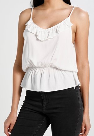 Haut sans manches blanc avec un col froncé et une taille élastique. Fabriqué dans un tissu léger, avec de fines bretelles.